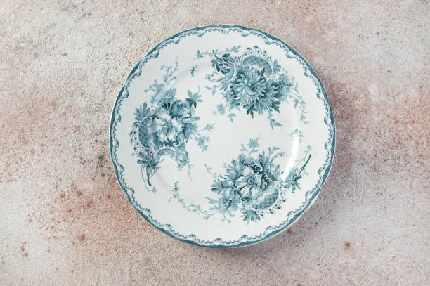 istock Antique porcelain plate on concrete 1221246622