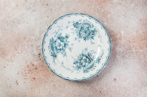 istock Antique porcelain plate on concrete 1221246855