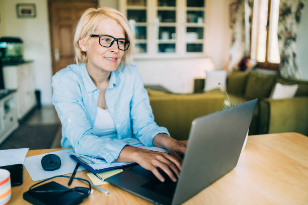istock MId age woman working from home 1221250328