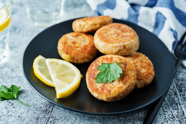 Canned tuna potato patties in a plate stock photo