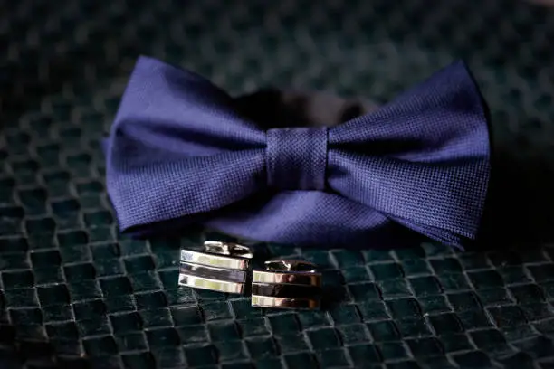 Beautiful bow tie and cuff links of the Groom before wedding - romantic detail