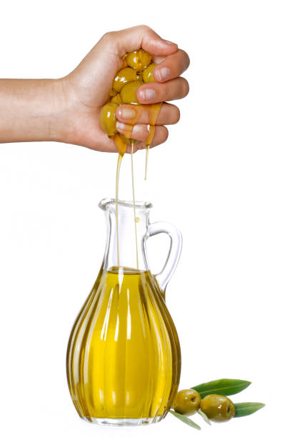 istock Olives oil squeeze hand 1221252933