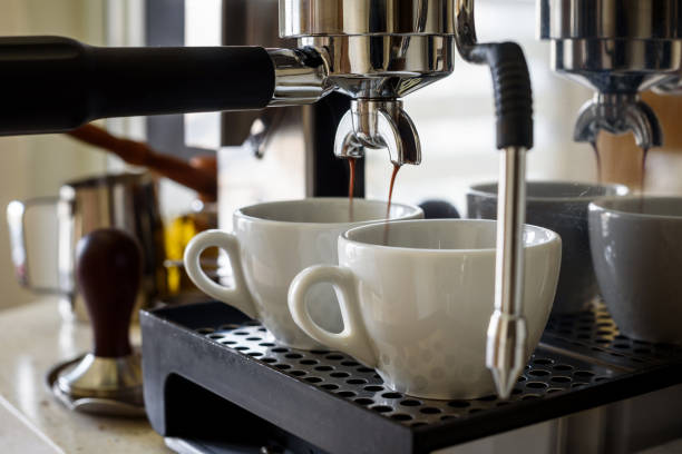 istock Preparing two cups of coffee on an espresso machine. 1221253613