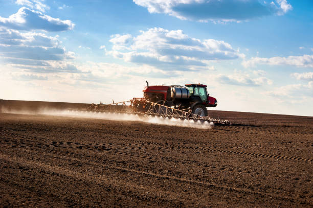 istock self-propelled sprayer in the field makes fertilizers in early spring 1221254891