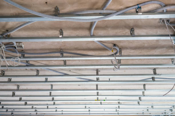 istock Electrical wiring on the concrete ceiling in drywall 1221255845