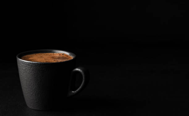 istock A cup of espresso with foam. Black stone background. Copy space for text. Close-up, shallow depth of field. Morning hours waiting for coffee. 1221256031
