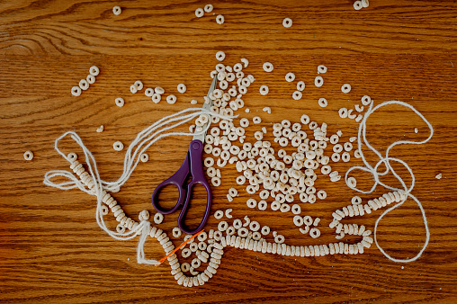 Cereal strung on String to Create a Cereal Necklace or Garland.