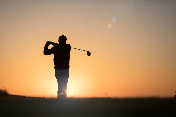 istock Golf player shoting ball at sunset time - Links golf player 1221256385