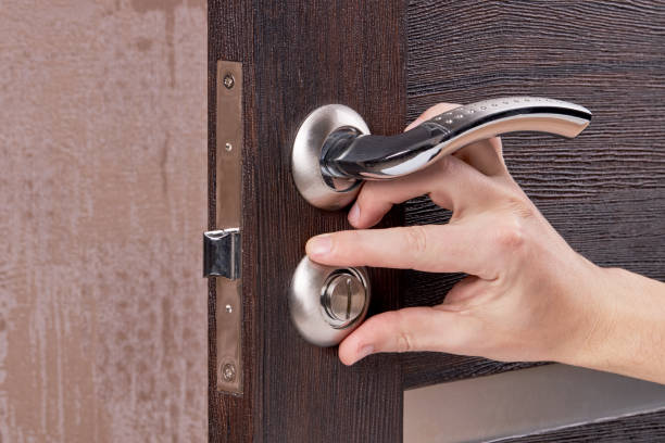 istock person fixing door furniture. improvement process. 1221257010