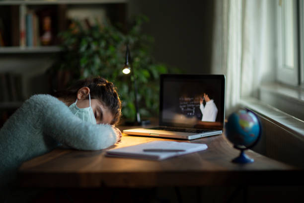 Coronavirus Outbreak. Lockdown and school closures. Schoolgirl watching online education class