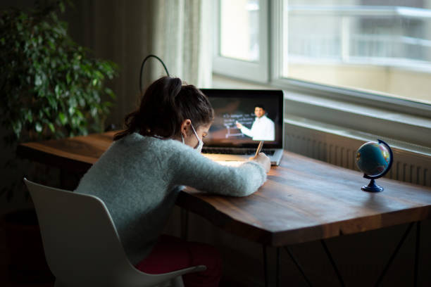 istock Coronavirus Outbreak. Lockdown and school closures. Schoolgirl watching online education class 1221258170