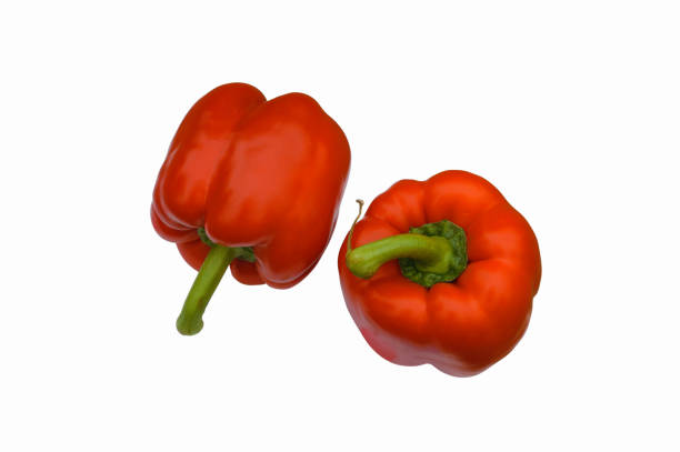 istock Two red bell peppers isolate on a white background close-up. 1221258338