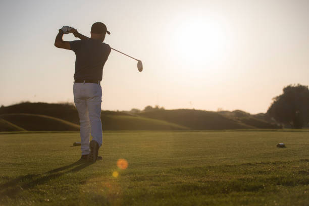 istock Golf players after stroke position 1221258375