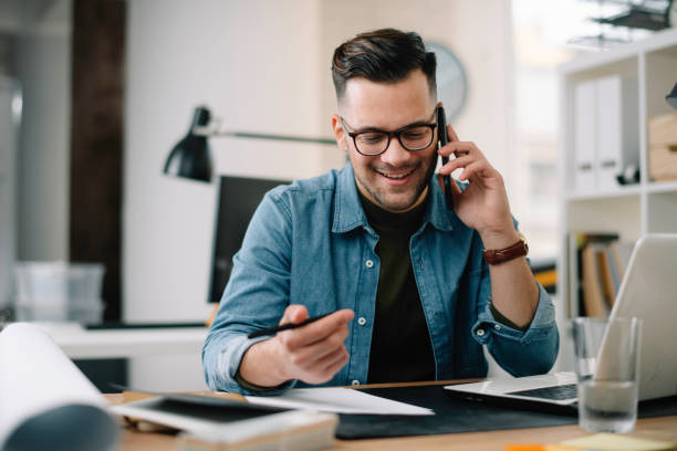 istock Handsome businessman working in office. 1221259506