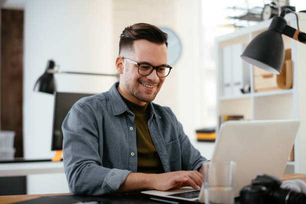 istock Handsome businessman working in office. 1221259517