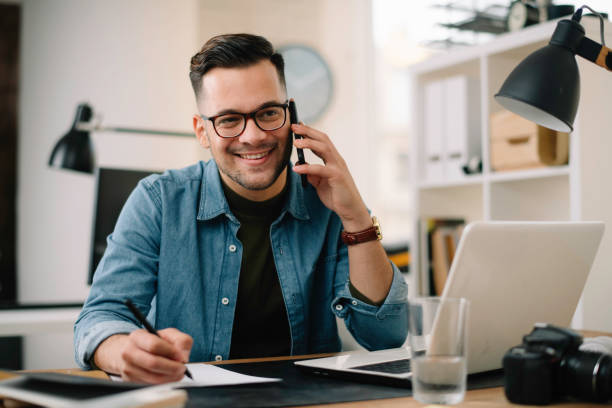 istock Handsome businessman working in office. 1221259519