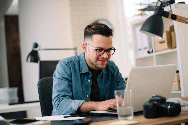 istock Handsome businessman working in office. 1221259534