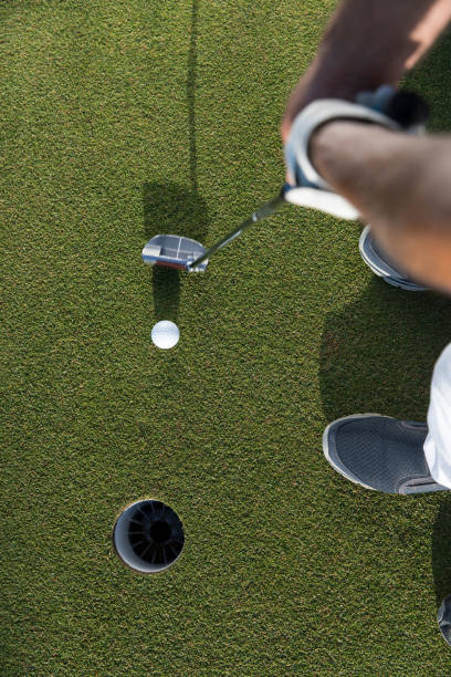 istock Golfer teeing off the ball - ready for putt - links golf 1221259704