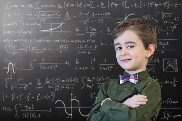 little boy mathematics formula an der tafel - mathematics mathematical symbol child intelligence stock-fotos und bilder