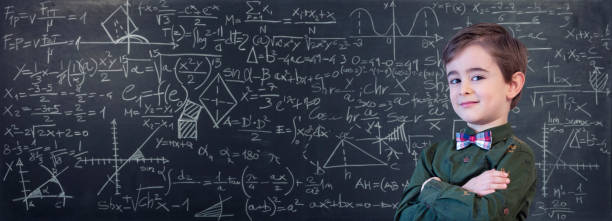 istock Little Boy Mathematics Formula on Chalkboard 1221259927