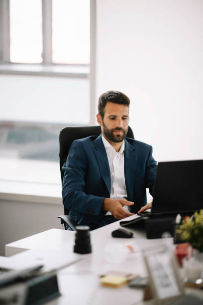 istock Young businessman working on lap top. 1221261872