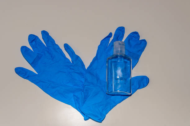 istock Set of Individual Protective Equipment to Avoid Getting Covid-19. Also Known As Coronavirus. Composed of some Blue Latex Hydroalcoholic Gel Gloves. 1221262832