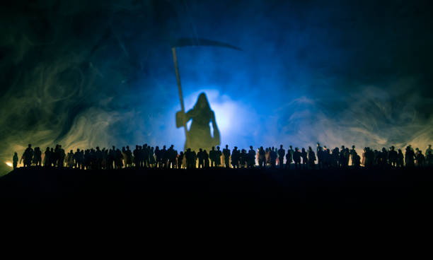 istock Coronavirus 2019-nCov novel coronavirus concept. Crowd looking on big Corona virus model at night with fog and backlight. Creative artwork decoration. Selective focus. 1221263015