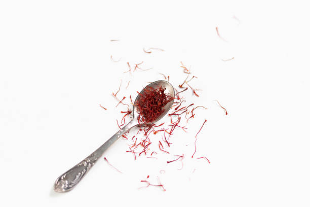 istock Vintage silver spoon with saffron spice  on white background 1221265236