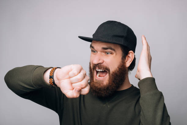 istock Young man is stressed when he sees the time on his wrist watch. 1221265479