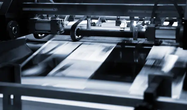 Photo of Polygraphic process in a modern printing house