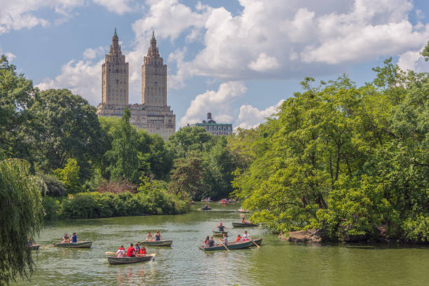 New York, NY / USA - July 24, 2019: The second largest man-made body of water in the Park, the Lake provides wonderful opportunities for viewing its abundant flora and fauna from rowboats, which are available for rent during the spring and summer months at the Loeb Boathouse.