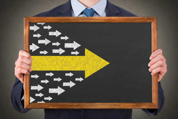 Leadership Concepts with Arrows on Chalkboard Background