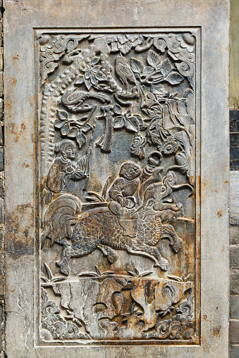 Stone carving wall of Pingyao temple in Shanxi, China