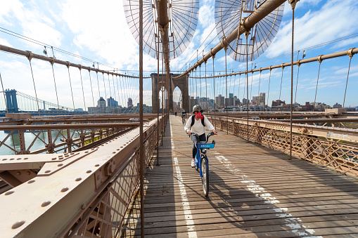 New York City, USA - April 25, 2020: Normally crowded Brooklyn bridge is empty with very few people due to the coronavirus pandemic in New York City.