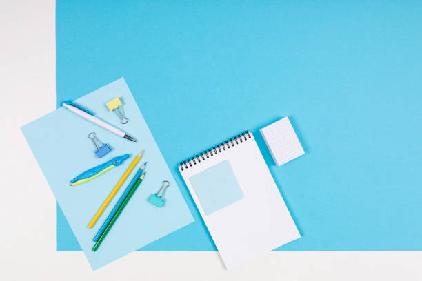 istock Stationery isolated on blue and white background 1221277631