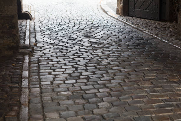 reflection of light on the pavement in city