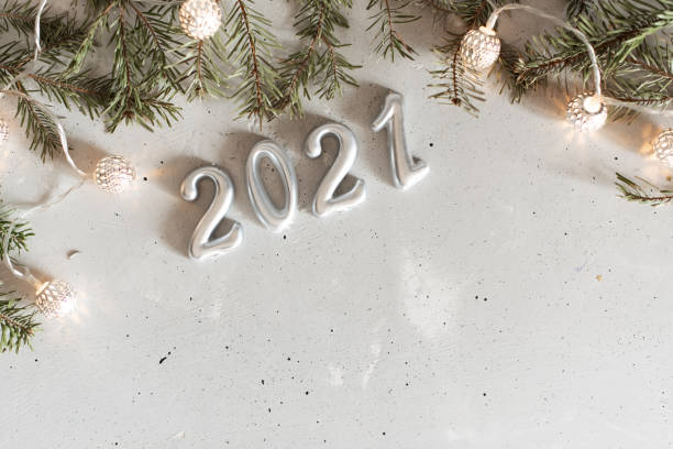 istock New Year 2021 silver balloons with fireworks 1221278755