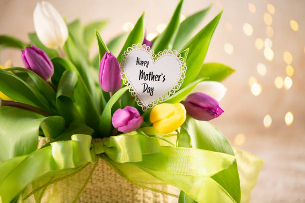istock Mother`s Day Greeting Card on a Flower Arrangement 1221279304