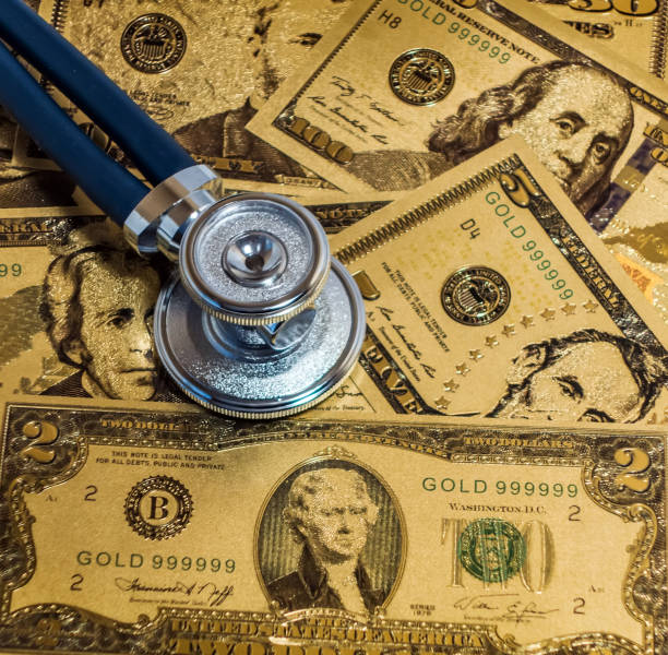 istock Stethoscopes US currency note bill design american dollars banknotes money 1221285241