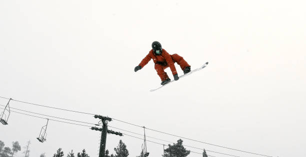 istock A Snowboarder in Full Winter Gear Attempting a 
