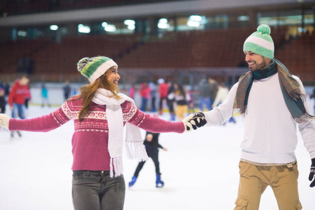 istock Young couple ice skating in winter 1221287826