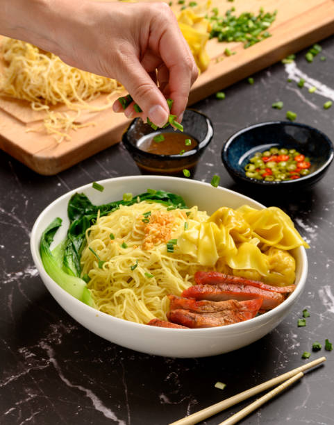 istock Dry Egg Noodles wonton with Red Roast Pork and Roast Duck. 1221288526