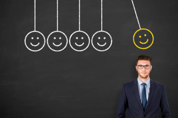istock Unhappy and Happy over Human Head on Blackboard 1221291222