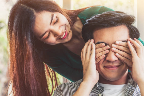 istock Happy Asian couple play covering eyes. 1221297438