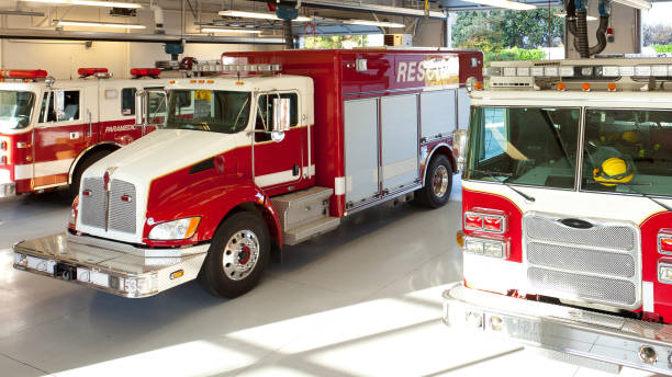 Fire Trucks in Firehouse Truck Bay stock photo