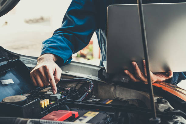 istock Professional mechanic providing car repair service 1221297579