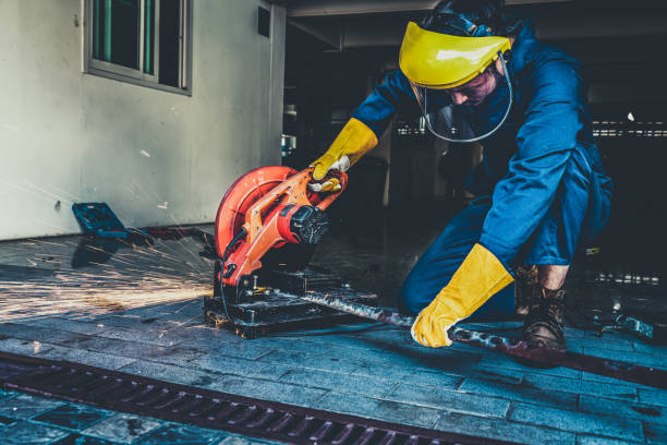 istock Professional mechanic is cutting steel metal. 1221297611
