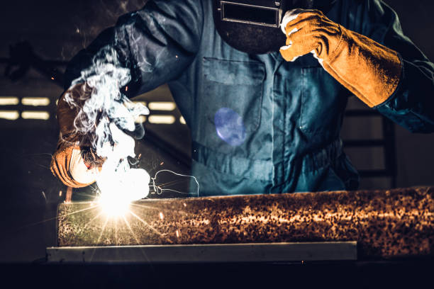 istock Metal welder working with arc welding machine. 1221297646