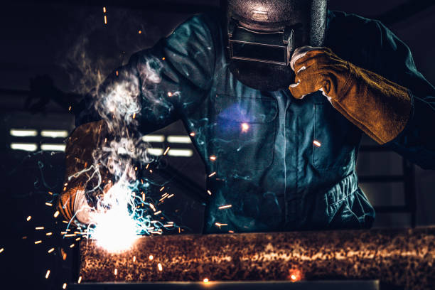 istock Metal welder working with arc welding machine. 1221297655