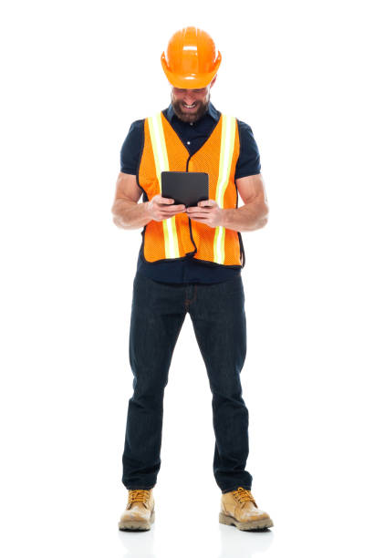 istock Building contractor standing wearing shirt and holding hammer and using digital tablet 1221299495